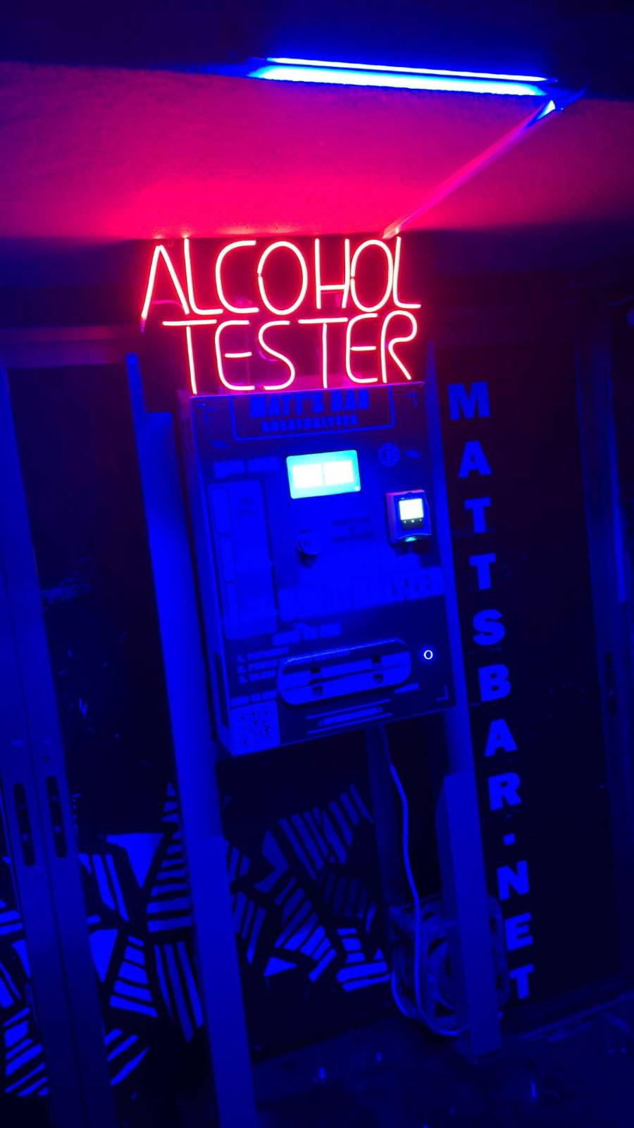 Breathly 2 stand with the red neon ALCOHOL TESTER header
